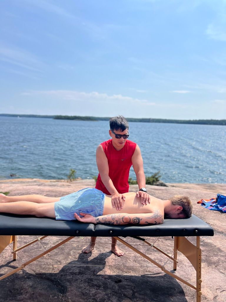 Mobile massage therapist providing RMT care at a client's home